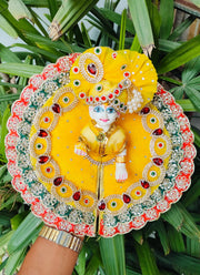 Festive special Yellow heavy dress with red and green lace combination with pagdi and choli