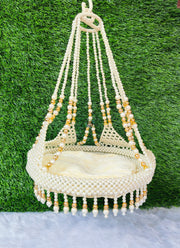 White jhula with golden pearls for laddu ji 