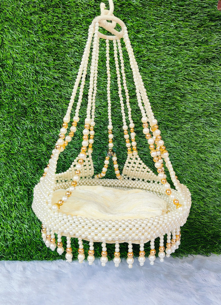 White jhula with golden pearls for laddu ji 